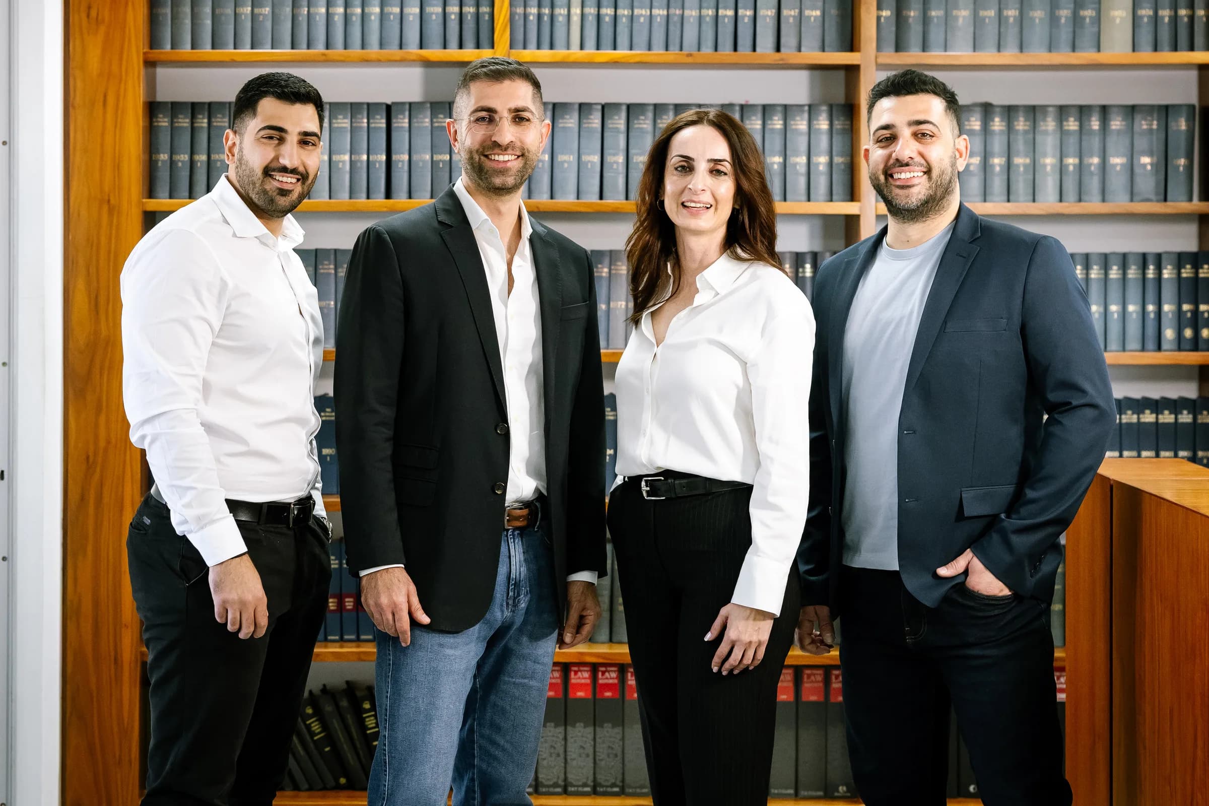 The Philippou Law Firm team in the firm's law library