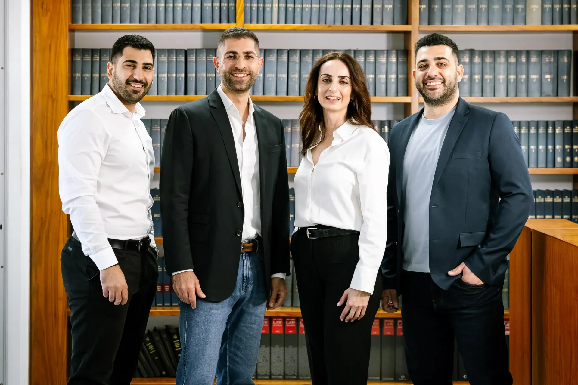 The Philippou Law Firm team in the firm's law library