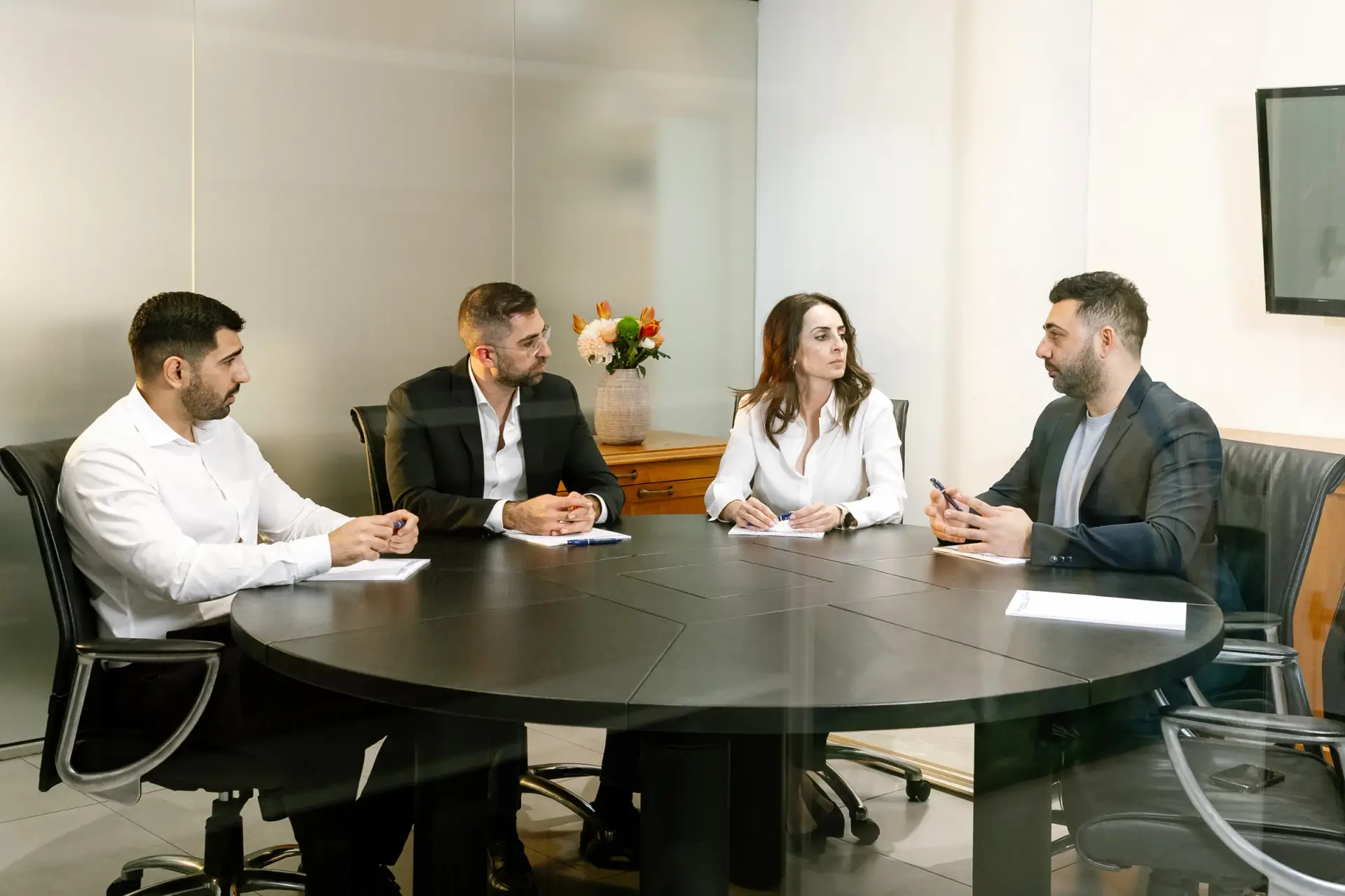 Business professionals reviewing financials in a Cyprus office