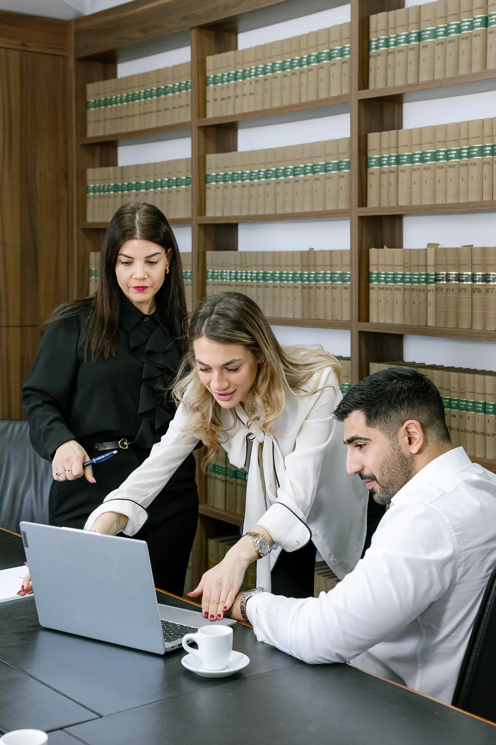Lawyers collaborating and reviewing a case in the law library